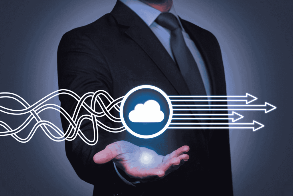 an image of a business man holding Cloud Solutions in his hand