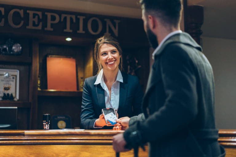 photo of happy hotel employee and guest due to revitalized IT infrastructure