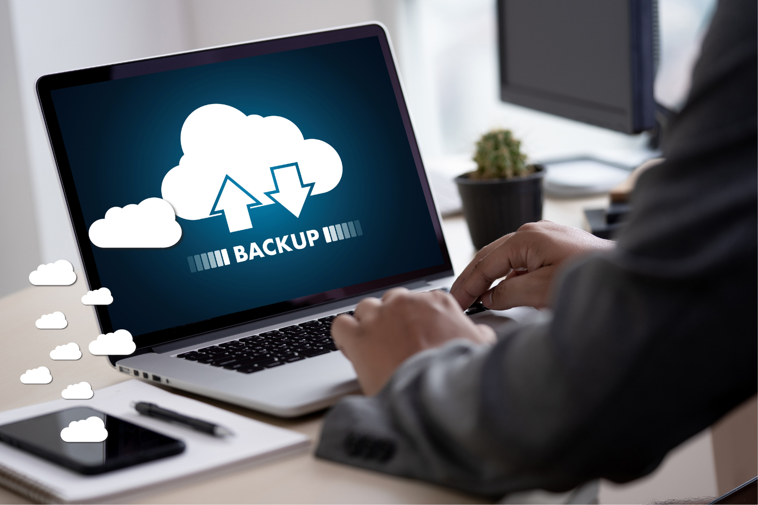 a photo of an IT technician implementing a Backup and Disaster Recovery plan to protect data