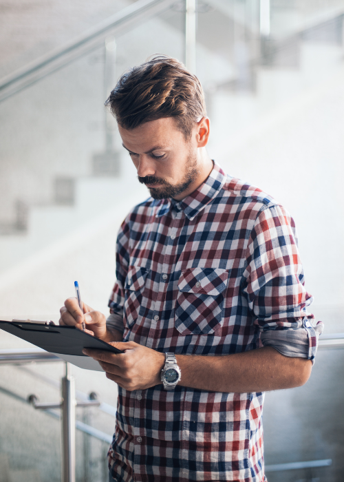 municipal worker looking at a checklist