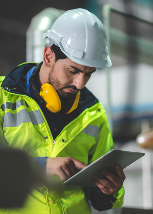 Manufacturing employee using a tablet